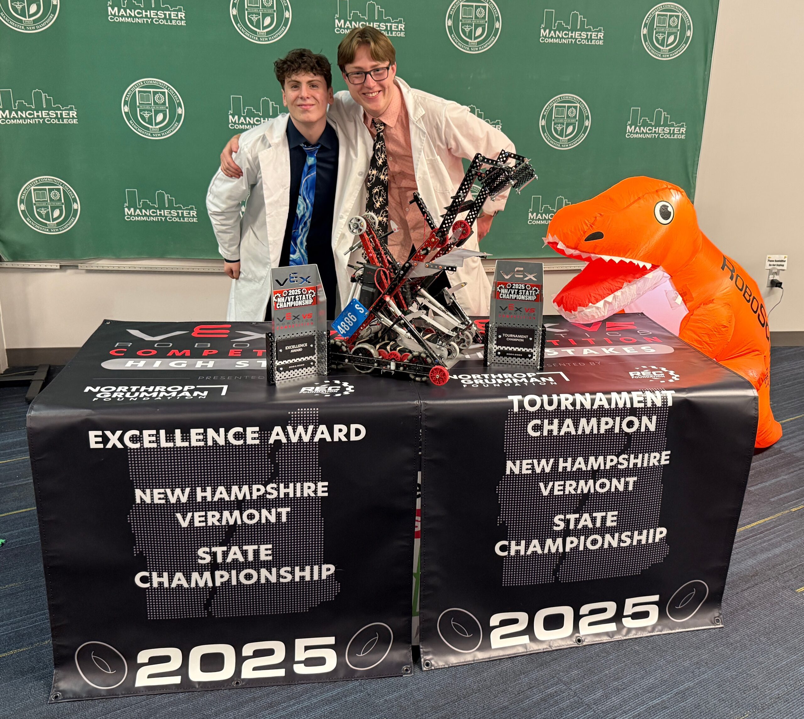 Duncan MacPhee and Connor Kutter-Walker pose with their trophies at the VT/NH VEX Robotics State Championship.