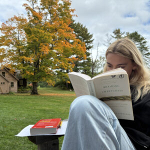 Student reading in outdoor classroom